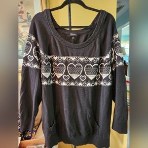 Black sweater with white heart design